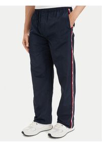 Tommy Jeans Spodnie dresowe DM0DM23123 Granatowy Relaxed Fit. Kolor: niebieski. Materiał: syntetyk #1