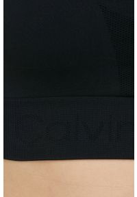 Calvin Klein Performance biustonosz sportowy Seamless kolor czarny gładki. Kolor: czarny. Materiał: skóra, materiał. Rodzaj stanika: wyciągane miseczki. Wzór: gładki. Sport: fitness, taniec #3