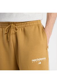Spodnie męskie New Balance MB61M77EABG – pomarańczowe. Kolor: pomarańczowy. Materiał: poliester, bawełna, materiał, dresówka. Wzór: aplikacja, napisy #5