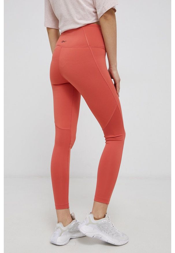 Reebok - Legginsy. Kolor: pomarańczowy. Materiał: dzianina, skóra