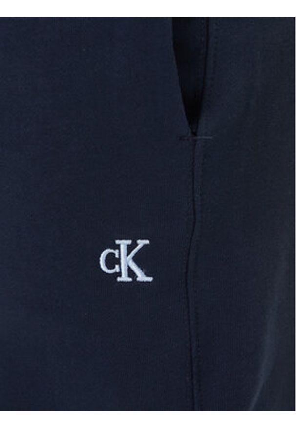 Calvin Klein Jeans Spodnie dresowe LV04RD241G Granatowy Regular Fit. Kolor: niebieski. Materiał: bawełna