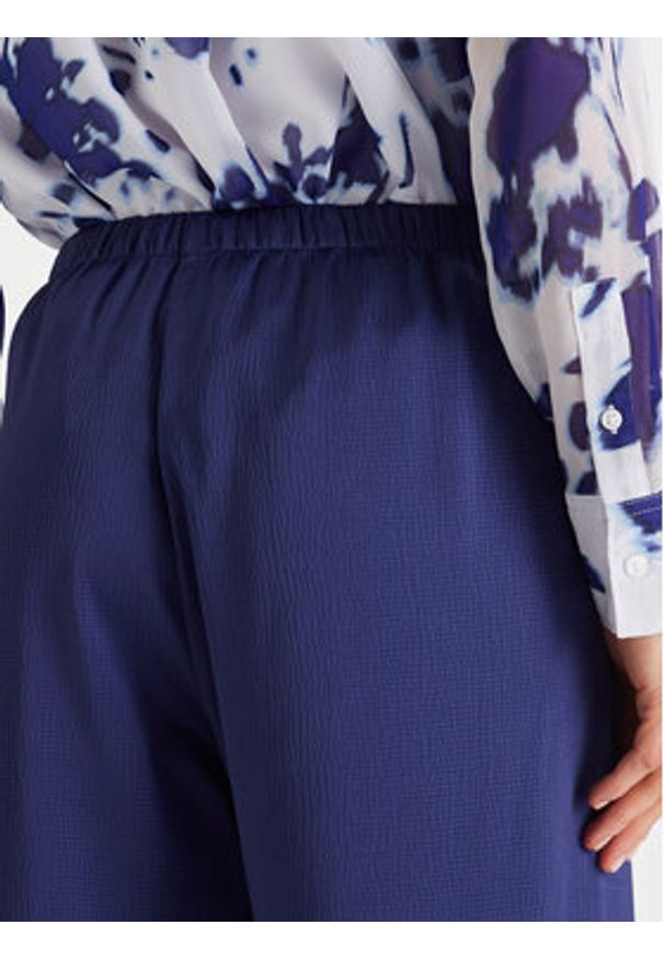 Calvin Klein Spodnie materiałowe LV044F611G Granatowy Regular Fit. Kolor: niebieski. Materiał: syntetyk