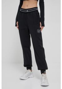 Adidas by Stella McCartney - adidas by Stella McCartney spodnie dresowe damskie kolor czarny gładkie. Kolor: czarny. Materiał: dresówka. Wzór: gładki #1