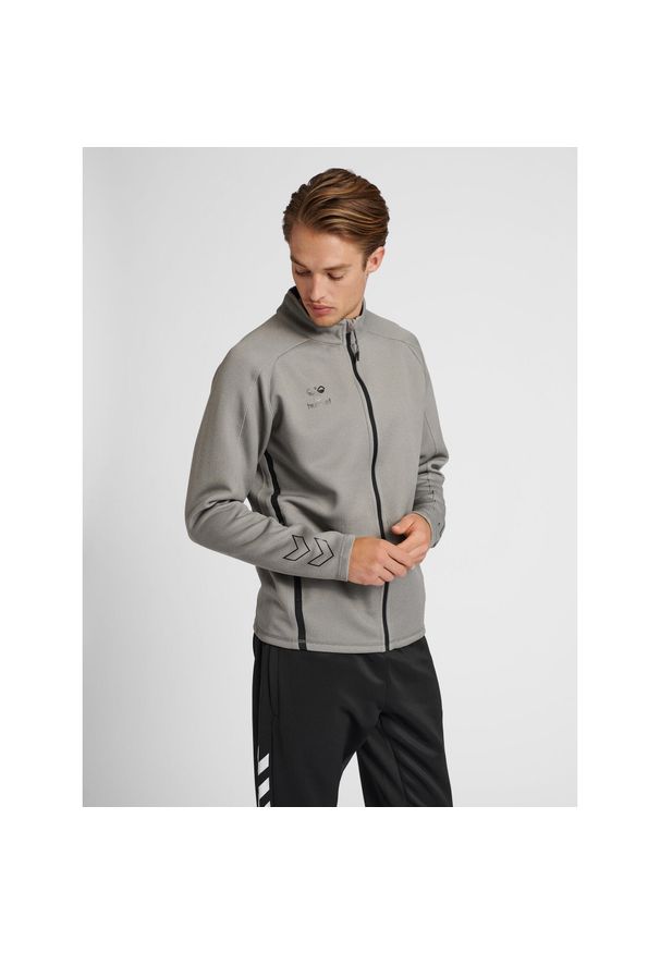 Bluza dresowa zapinana na zamek błyskawiczny Hummel Cima XK. Kolor: szary. Materiał: dresówka. Wzór: nadruk