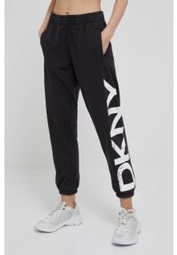 DKNY - Dkny spodnie damskie kolor czarny z nadrukiem. Kolor: czarny. Wzór: nadruk