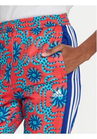 Adidas - adidas Spodnie dresowe FARM Rio IQ4492 Czerwony Regular Fit. Kolor: czerwony. Materiał: bawełna