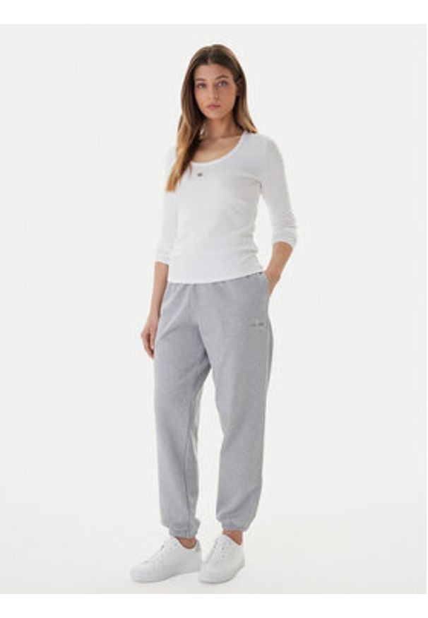 Calvin Klein Jeans Spodnie dresowe Foil Monologo LV047E826G Szary Regular Fit. Kolor: szary. Materiał: bawełna