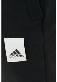 Adidas - adidas spodnie dresowe kolor czarny z aplikacją. Kolor: czarny. Materiał: dresówka. Wzór: aplikacja #2