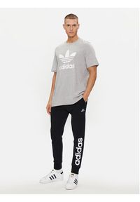 Adidas - adidas Spodnie dresowe Essentials French Terry Tapered Cuff Logo Joggers IC0063 Czarny Regular Fit. Kolor: czarny. Materiał: bawełna #2