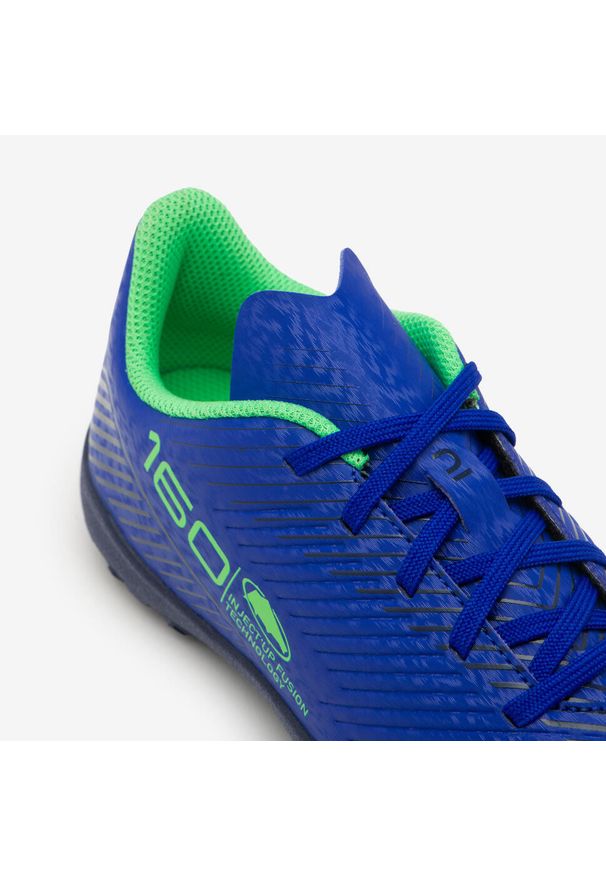 KIPSTA - Buty piłkarskie dla dzieci Kipsta 160 Turf .TF sznurowane. Nosek buta: okrągły. Zapięcie: rzepy. Kolor: niebieski. Materiał: poliester. Szerokość cholewki: normalna. Sport: piłka nożna