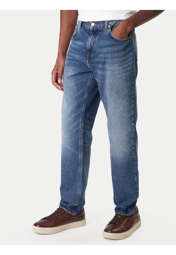 TOMMY HILFIGER - Tommy Hilfiger Jeansy Harlem MW0MW41890 Niebieski Tapered Fit. Kolor: niebieski