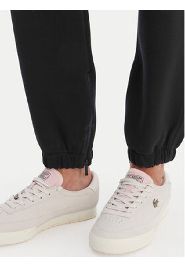 Lacoste Spodnie dresowe XF5244 Granatowy Regular Fit. Kolor: niebieski. Materiał: bawełna
