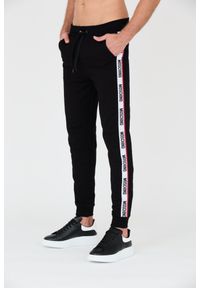 MOSCHINO Czarne męskie spodnie dresowe z lampasami, Rozmiar L. Kolor: czarny. Materiał: dresówka #5