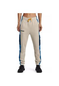 Under Armour - Spodnie treningowe Rival Fleece SP Pant - piaskowy. Kolor: beżowy. Materiał: dresówka #1