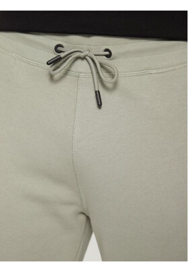 Guess Spodnie dresowe Z2YB22 K9V31 Zielony Regular Fit. Kolor: zielony. Materiał: bawełna