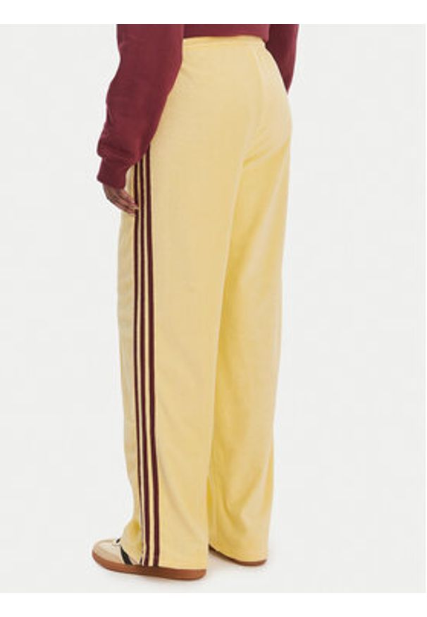 Adidas - adidas Spodnie dresowe Terry Towel Firebird KQ6662 Żółty Loose Fit. Kolor: żółty. Materiał: bawełna