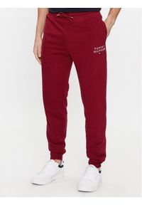 TOMMY HILFIGER - Tommy Hilfiger Spodnie dresowe UM0UM02880 Czerwony Regular Fit. Kolor: czerwony. Materiał: bawełna