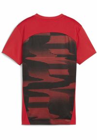 Puma - Damska koszulka przedmeczowa z krótkim rękawem AC Milan PUMA. Kolor: czerwony, wielokolorowy, czarny. Długość rękawa: krótki rękaw. Długość: krótkie