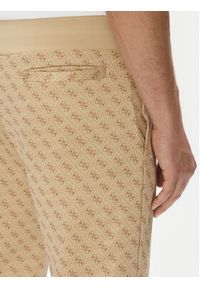 Guess Spodnie dresowe Korbin Z2BB05 FL04Q Beżowy Regular Fit. Kolor: beżowy. Materiał: bawełna, syntetyk
