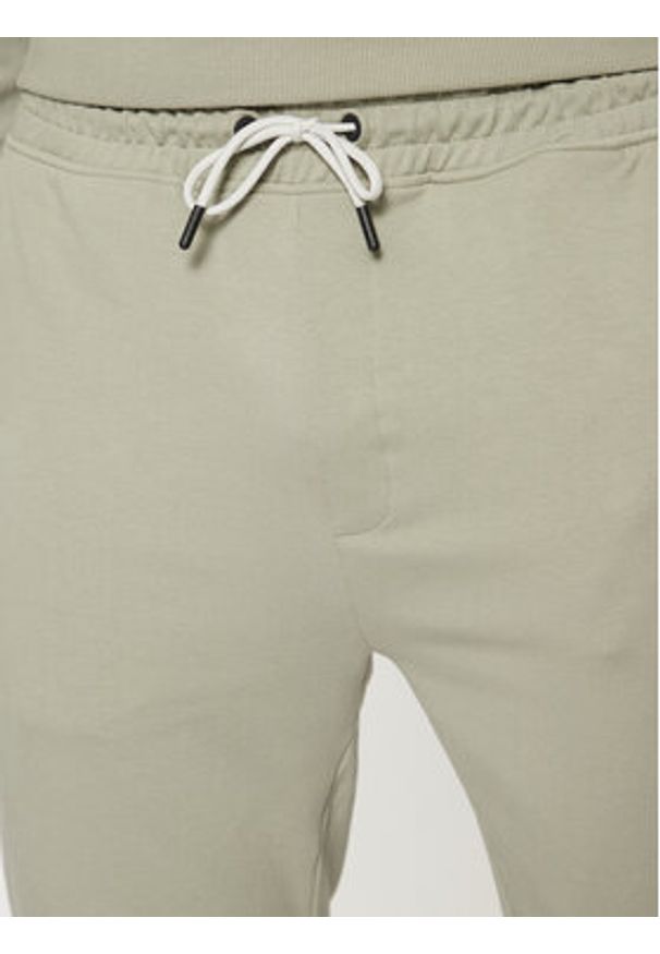 Guess Spodnie dresowe Z2YB19 K6ZS1 Zielony Regular Fit. Kolor: zielony. Materiał: bawełna