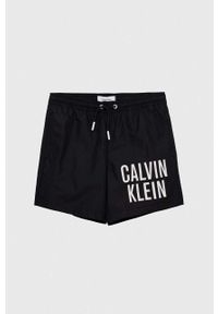 Calvin Klein Jeans szorty kąpielowe dziecięce kolor czarny. Kolor: czarny. Materiał: poliester, materiał. Wzór: nadruk