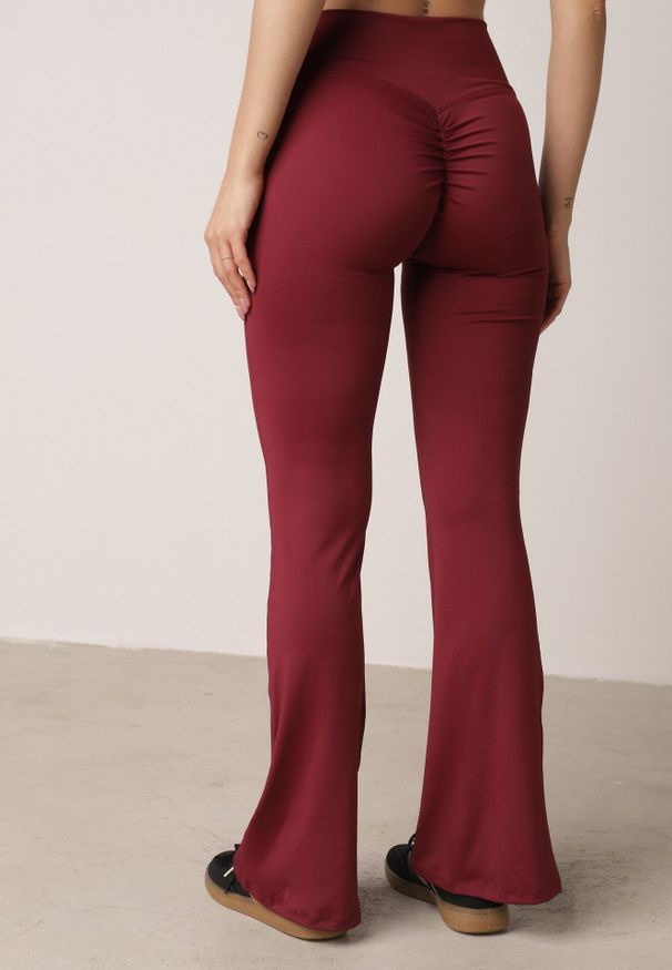 Born2be - Bordowe Legginsy Typu Dzwony z Wysokim Stanem Orralise. Okazja: na spacer. Stan: podwyższony. Kolor: czerwony. Długość: krótkie. Styl: sportowy