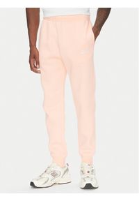 Nike Spodnie dresowe BV2671 Pomarańczowy Regular Fit. Kolor: pomarańczowy. Materiał: bawełna