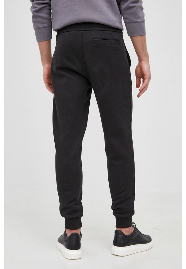 Calvin Klein Jeans Spodnie męskie kolor czarny z nadrukiem. Kolor: czarny. Materiał: dzianina. Wzór: nadruk