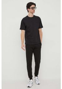 Calvin Klein spodnie dresowe kolor czarny gładkie. Kolor: czarny. Materiał: dresówka. Wzór: gładki #4