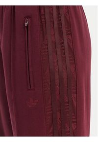 Adidas - adidas Spodnie dresowe Firebird Lace KC6445 Bordowy Loose Fit. Kolor: czerwony. Materiał: syntetyk #2