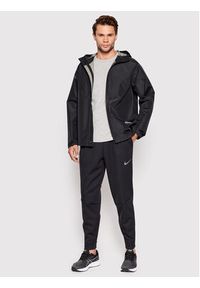 Nike Spodnie dresowe Pro Therma-Fit DD2122 Czarny Standard Fit. Kolor: czarny. Materiał: syntetyk, dresówka