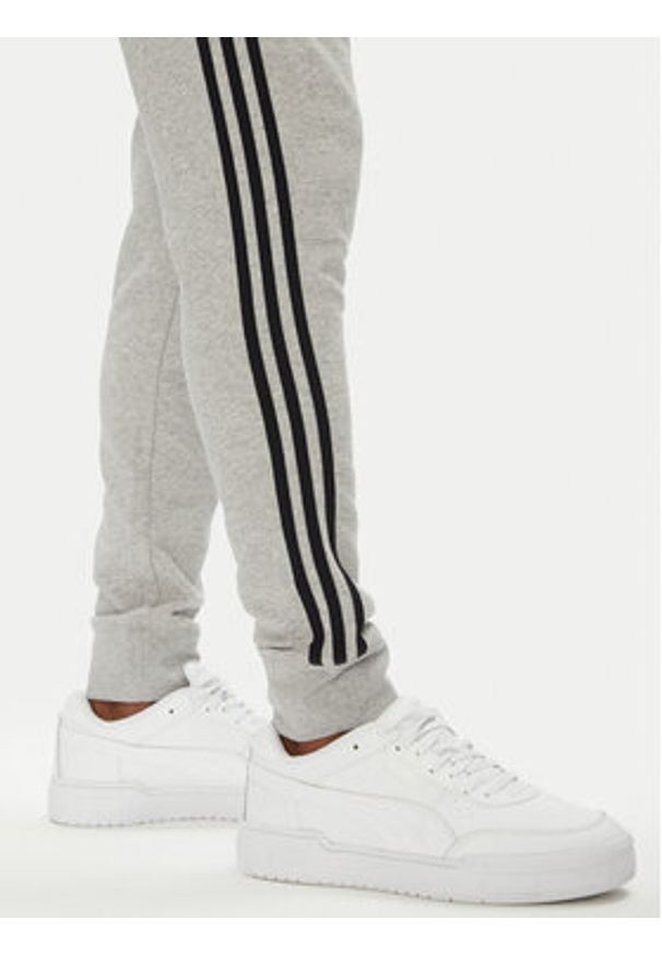 Adidas - adidas Spodnie dresowe adicolor 3-Stripes JY1387 Szary Slim Fit. Kolor: szary. Materiał: bawełna