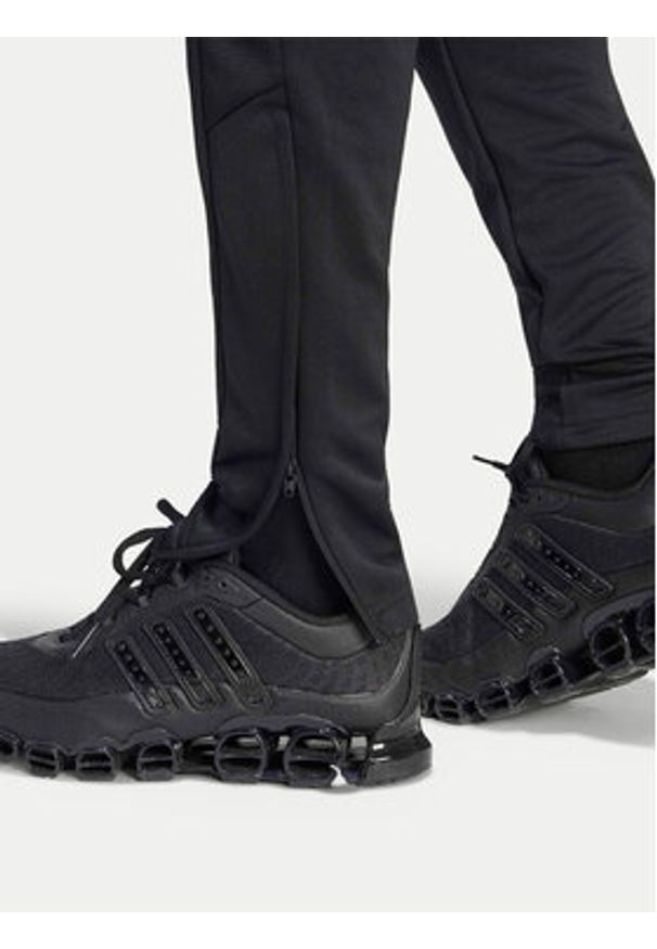 Adidas - adidas Spodnie dresowe Tiro 25 Essentials Training KG0809 Czarny Regular Fit. Kolor: czarny. Materiał: syntetyk