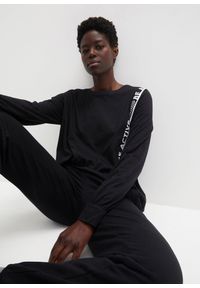 bonprix - Luźniejsza koszulka sportowa. Kolor: czarny. Długość rękawa: długi rękaw. Długość: długie. Styl: sportowy #1