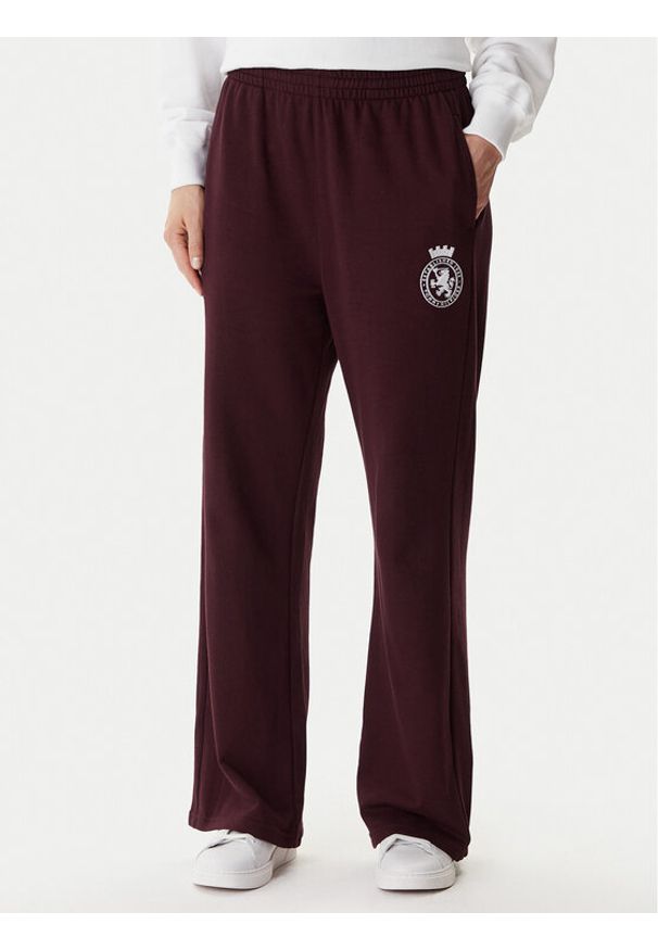 TOMMY HILFIGER - Tommy Hilfiger Spodnie dresowe UW0UW06081 Bordowy Wide Leg. Kolor: czerwony. Materiał: bawełna
