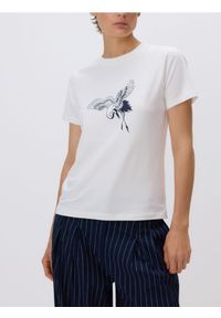 Reserved - T-shirt z nadrukiem - złamana biel. Materiał: dzianina, bawełna. Wzór: nadruk