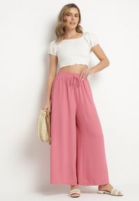 Born2be - Różowe Szerokie Spodnie Typu Palazzo z Wiązaniem Ulialitia. Okazja: na co dzień. Stan: podwyższony. Kolor: różowy. Styl: elegancki, casual #7