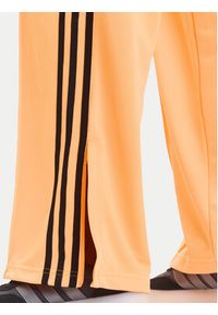 Adidas - adidas Spodnie dresowe adicolor Classic Firebird JY2694 Żółty Loose Fit. Kolor: żółty. Materiał: syntetyk