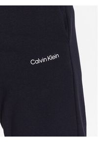 Calvin Klein Spodnie dresowe Micro Logo K10K109940 Granatowy Regular Fit. Kolor: niebieski. Materiał: bawełna, syntetyk #3