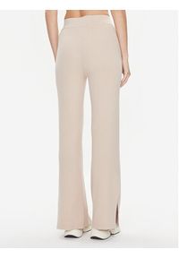 Calvin Klein Spodnie dzianinowe Essential K20K206023 Beżowy Wide Leg. Kolor: beżowy. Materiał: dzianina, syntetyk