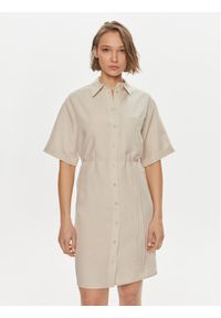 Calvin Klein Sukienka koszulowa K20K206697 Beżowy Relaxed Fit. Kolor: beżowy. Materiał: lyocell. Typ sukienki: koszulowe #1