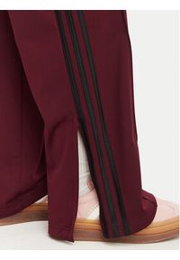 Adidas - adidas Spodnie dresowe Firebird Loose Tracksuit KS4669 Bordowy Loose Fit. Kolor: czerwony. Materiał: syntetyk #2