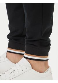 BOSS Spodnie dresowe Iconic 50554830 Czarny Regular Fit. Kolor: czarny. Materiał: bawełna #3