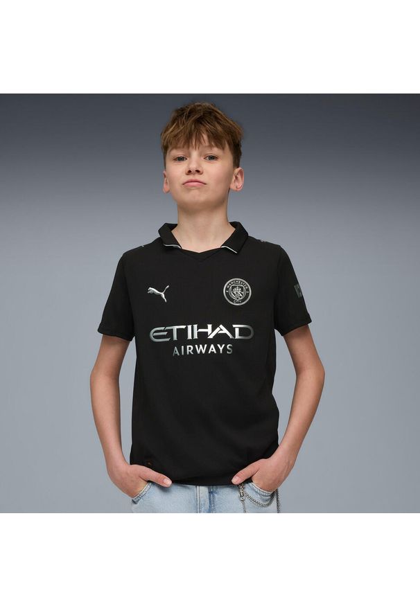 Puma - Koszulka wyjazdowa dziecięca Manchester City 2025/26. Kolor: czarny. Sport: piłka nożna