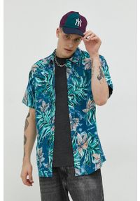 Volcom koszula męska kolor niebieski regular z kołnierzykiem klasycznym. Typ kołnierza: kołnierzyk klasyczny. Kolor: niebieski. Materiał: tkanina. Długość rękawa: krótki rękaw. Długość: krótkie. Styl: klasyczny #1