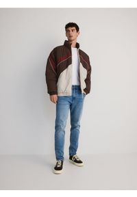 Reserved - Jeansy slim z efektem sprania - niebieski. Kolor: niebieski #1