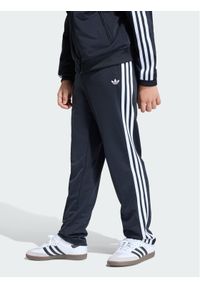 Adidas - adidas Spodnie dresowe Firebird Track KE0910 Czarny Regular Fit. Kolor: czarny. Materiał: syntetyk #1