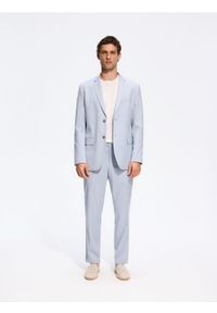 Reserved - Garniturowe spodnie slim fit - jasnoniebieski. Kolor: niebieski. Materiał: tkanina, wiskoza #1
