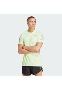 Adidas - Koszulka Own the Run Allover Print. Kolor: biały, wielokolorowy, żółty. Materiał: materiał. Wzór: nadruk. Sport: bieganie