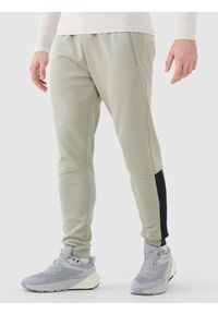 4f - 4F Spodnie treningowe szybkoschnące męskie - khaki XXL. Kolor: oliwkowy, brązowy, wielokolorowy. Materiał: syntetyk, dresówka, materiał, dzianina, włókno, elastan. Wzór: jednolity, ze splotem. Sport: fitness